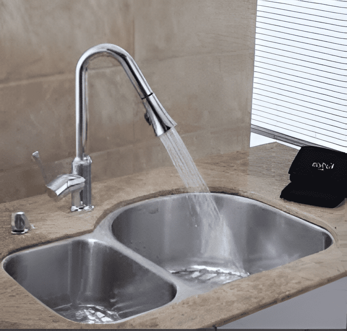 Dual-basin stainless steel kitchen sink with a high-arc faucet, newly installed.