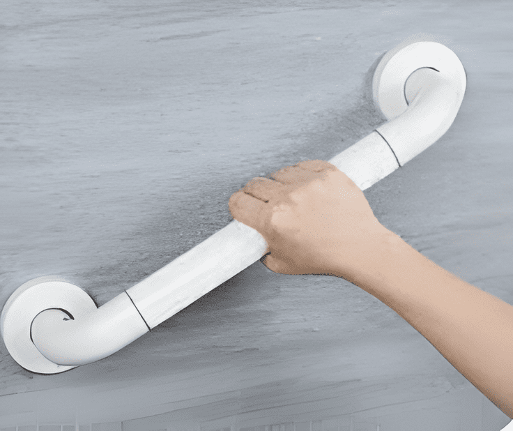 White grab bar securely mounted to a bathroom wall for safety.