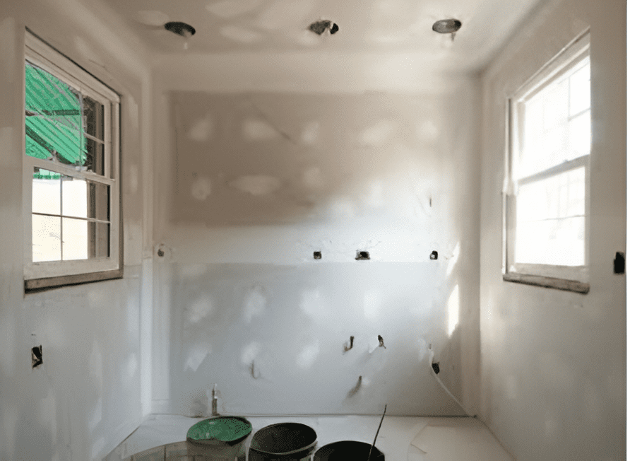 Unfinished room with new drywall installed, ready for finishing.